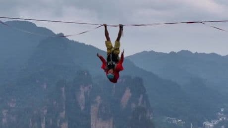Competitors walk slackline 400m above Chinese gorge in bid for championship glory