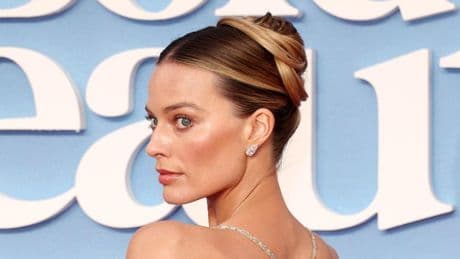 Photos: Margot Robbie And Dakota Johnson Go With ‘Naked’ Looks At Premieres