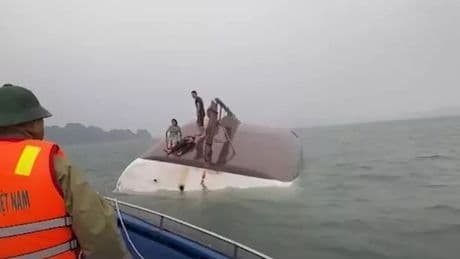 Vietnam tourist boat capsizes with at least 18 bodies recovered