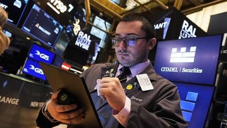 Wall Street is split as Tesla and tech drop while most other U.S. stocks climb