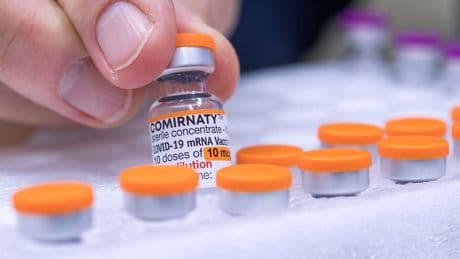 FDA requires updated warning about rare heart risk with COVID shots
