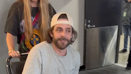 Country star Thomas Rhett leaves concert in a wheelchair after being invited onstage to perform