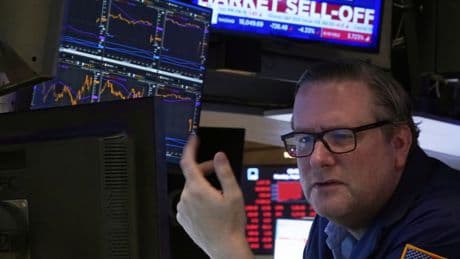 Stocks sink on Bay and Wall Streets, but loonie rises following new tariffs