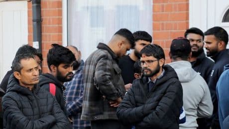 Crowds gather outside Air India crash survivor's home awaiting news on brother