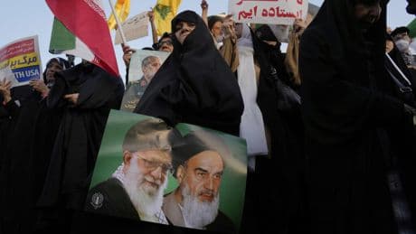 Battered by war, Tehran responds with repression and paranoia