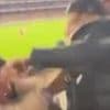 See the shocking moment a man and woman get into a physical clash at AFL match - even though they support the same team