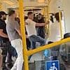 Vigilante commuter who stepped in when passenger dropped his trousers in front of children on packed London Tube is now questioned by police