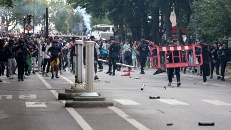 Chaos erupts in Paris as riot cops clash with PSG fans at Champions League victory parade in second night of violence