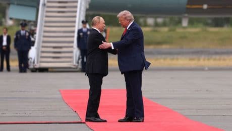 Red carpets and flypasts: In Alaska, an indicted war criminal was feted like a king