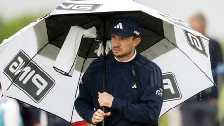 Schot Syme wint KLM Open, Huizing eindigt als 19de na natte en winderige slotdag