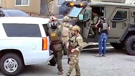 Heavily armed federal agents blow door off suspect’s home. He wasn’t there — but girlfriend and kids were