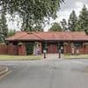 Council is forced to ditch plans to slap 20 per cent 'fat tax' on wider burial plots after facing a furious backlash