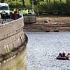 Girl, 13, is missing after plunging from a reservoir dam in front of her horrified father while taking a photograph