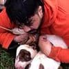 Dramatic moment Muay Thai instructor uses martial arts skills to restrain pit bulls after they brutally attacked him