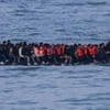 Germany to tighten people-smuggling law as chancellor visits UK