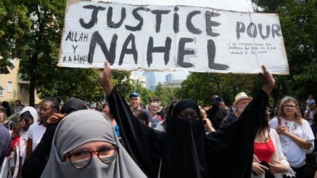 A French police officer will stand trial over the killing of a teen that sparked nationwide riots