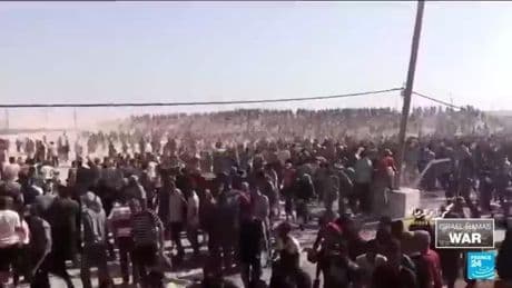 Israel tank, gunfire heard as Palestinians in Gaza try to reach aid