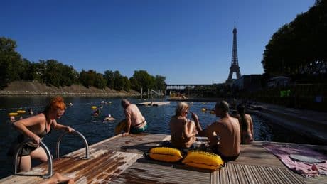 The Seine in Paris is open for swimming. Tourists and residents embrace it as temperatures soar