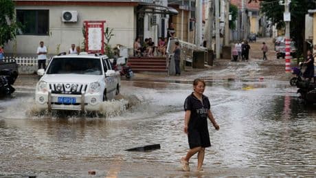 China floods: At least 30 killed in Beijing and 80,000 evacuated
