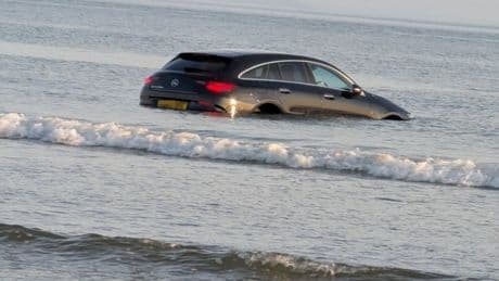 New £90,000 Mercedes engulfed by waves after hapless driver gets STUCK on beauty spot beach
