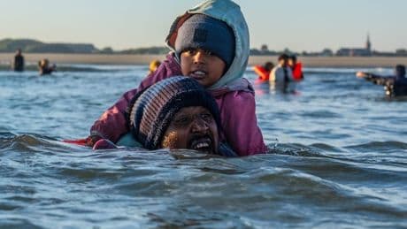 Desperate 'end this tide of misery' plea as child held afloat in English Channel