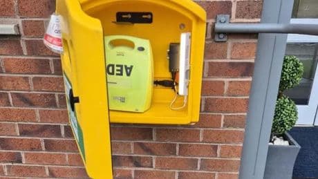 Wishaw opticians helps restore defibrillator back to lifesaving service at veterans' hub