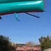 Terrifying moment two children cheat death after falling from bouncy castle blown 40 feet into the air during school fund-raiser