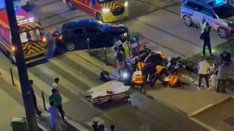 Four injured after car ploughs into crowd celebrating PSG Champions League win in Grenoble with woman fighting for life