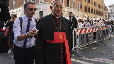 Vatican workers install Sistine Chapel stove where ballots are burned during conclave to elect pope