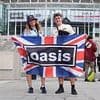 Oasis mania hits Wembley! Bucket-hat wearing fans from across the world queue up for the Gallagher brothers' first London gig in 16 years