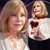 Kim Novak, 92, displays her incredibly smooth complexion at the Deauville American Film Festival in France as she accepts the Icon Award