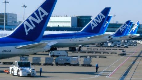 A flight from Tokyo was forced to divert to Seattle after an 'unruly' passenger tried to open the exit doors
