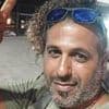 Family of father who was devoured by sharks off Israeli beach reveals he tried to fend off beasts with Go-Pro stick while attempting to film them in the water