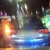 Driver who dragged police officers down road with car is jailed