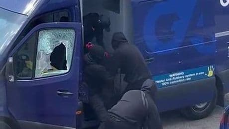 Masked robbers filmed stealing cash from armoured security van