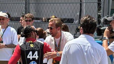 Harry Kane greets Lewis Hamilton as England players take in Spanish Grand Prix