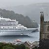 Locals hit out at the 'disgusting' massive cruise ships they say are over-running their gorgeous Cornish town with tourists