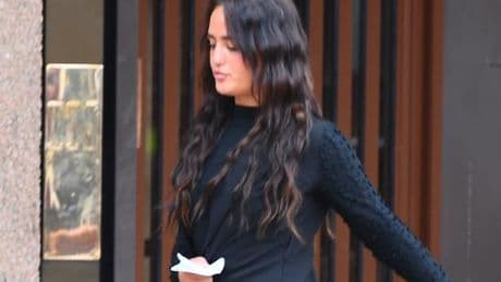 Mum laughs as she leaves court after 'taking law into own hands' with 'brutal assault'