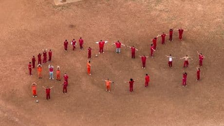 SOS scrawled in dirt by men fearing deportation to El Salvador prison
