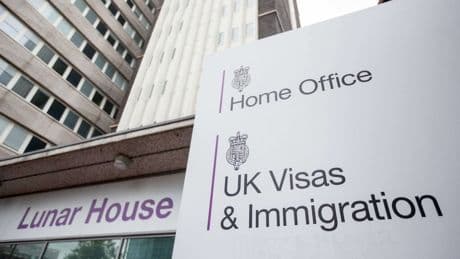 Number of foreign nationals arriving on work visas falls by nearly a half