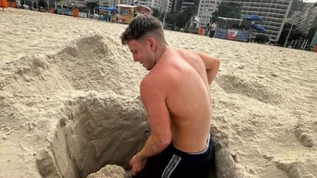Moment Brit beachgoer is saved after being swallowed by quicksand in 8ft hole he’d dug -as he says ‘I thought I’d die’