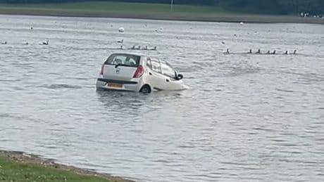 Car sinks after rolling into loch at Scots country park as man charged