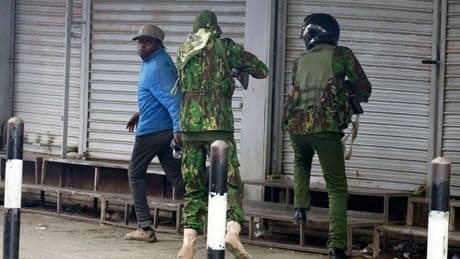 Photos capture the shooting of a civilian by a Kenyan police officer amid protests