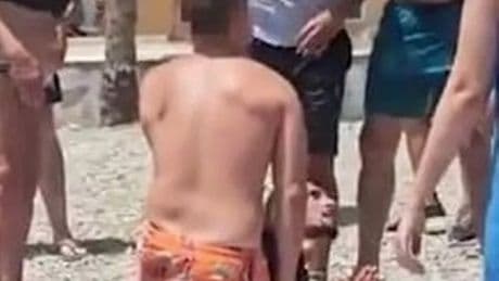 Moment migrants detained on Spanish beach after being tackled by tourists