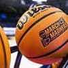 Top college basketball coach arrested in alleged drunk driving incident after 'hitting curbs and driving onto someone's lawn'