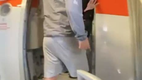 Moment EasyJet passenger screams expletive-laden abuse at flight crew before he’s SLAPPED by fuming staff