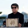 Iran's Palme d'Or-winning director cheered as he arrives home