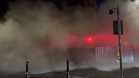 Moment dust cloud blankets Glasgow street after tenement block collapses