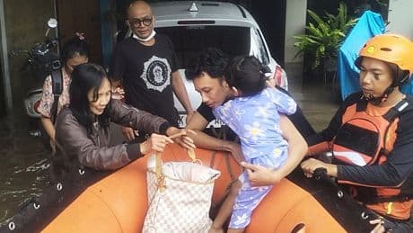 Indonesian rescuers search for missing people as floods recede