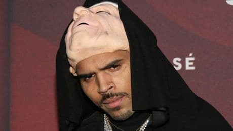 Chris Brown's entourage arrives at court as singer remanded in custody